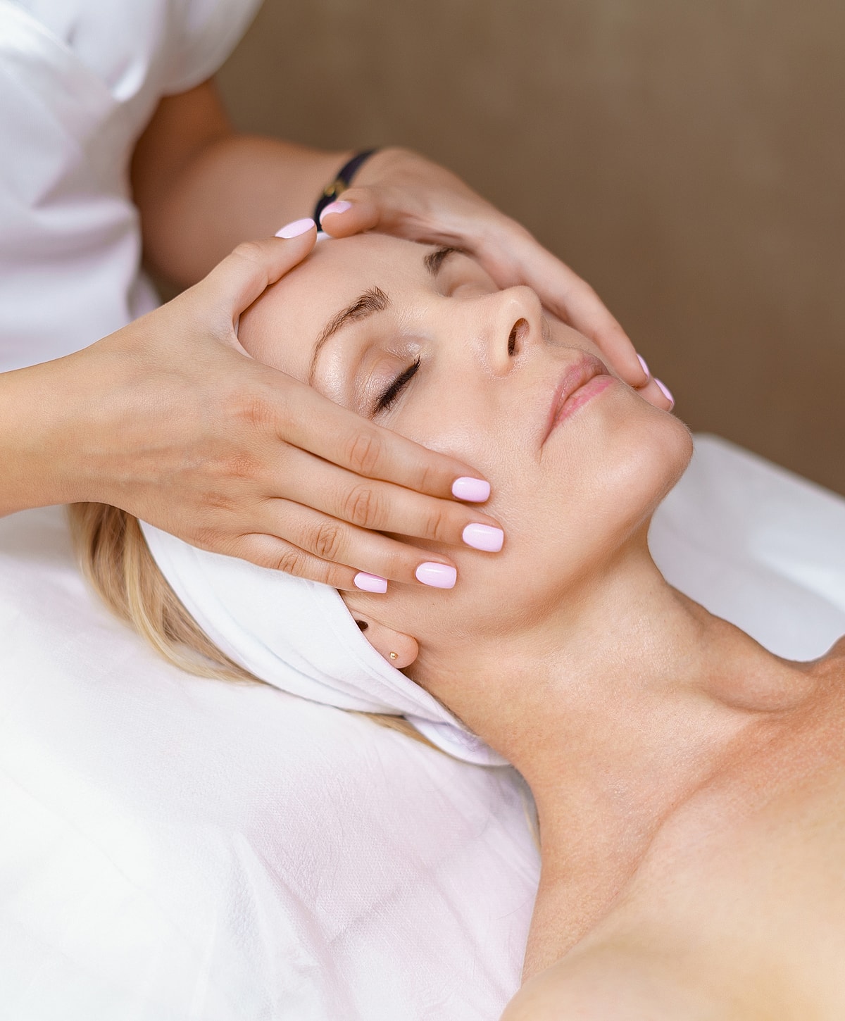 Charlotte, NC European Facial model enjoying a facial massage therapy session.