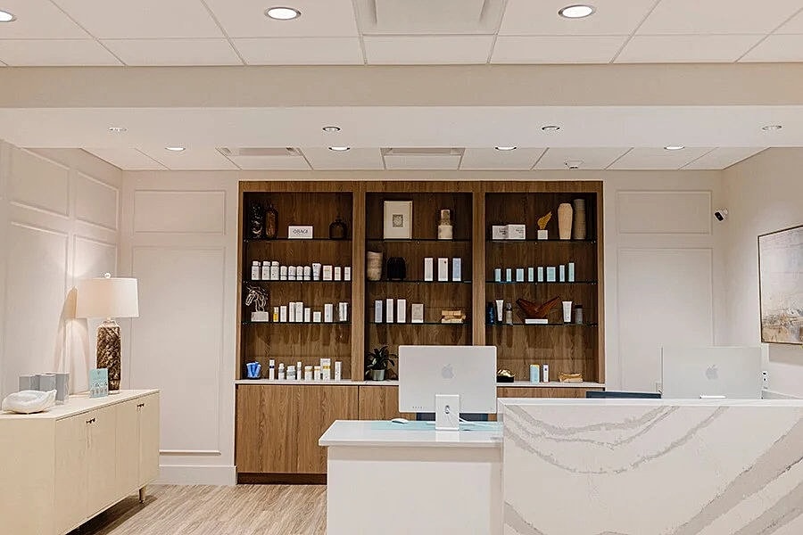 Modern spa reception area with skincare products.
