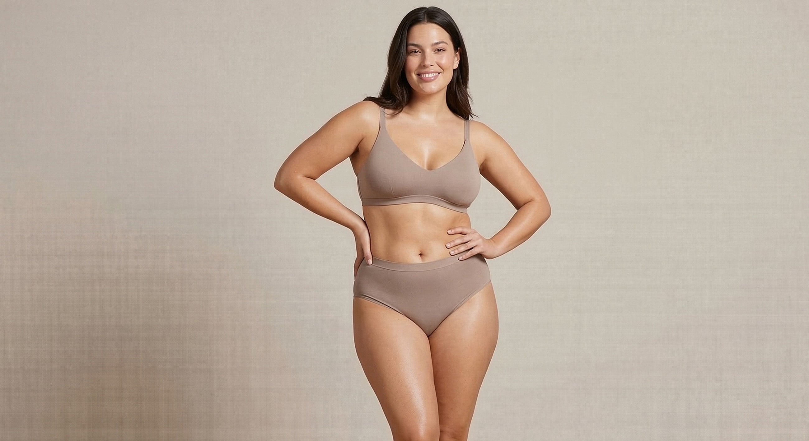 Charlotte, NC after weight loss surgery model wearing brown lingerie, smiling confidently.